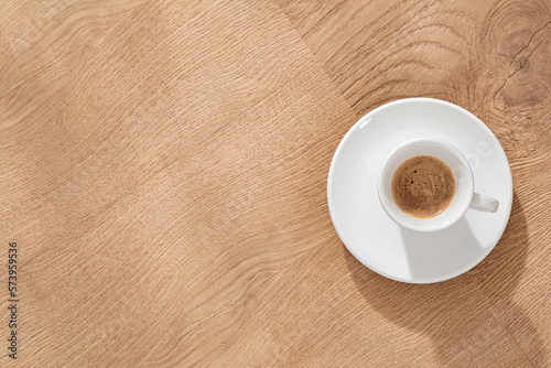 Small Coffee Cup on Oak Desk
