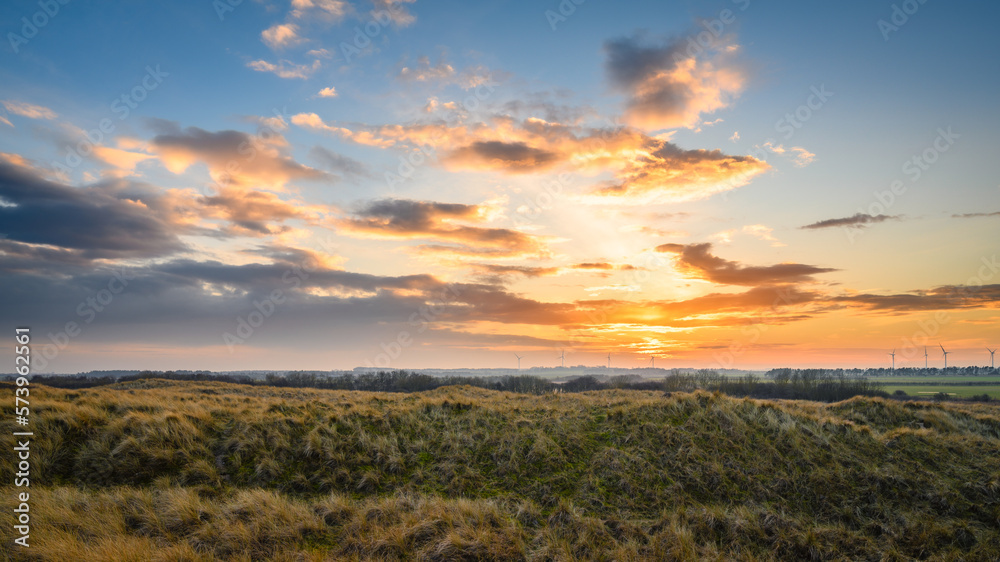 Sunset from Druridge Bay Dunes, located on the North Sea in Northumberland's AONB in England, it is a 7 miles long bay between Amble and Cresswell