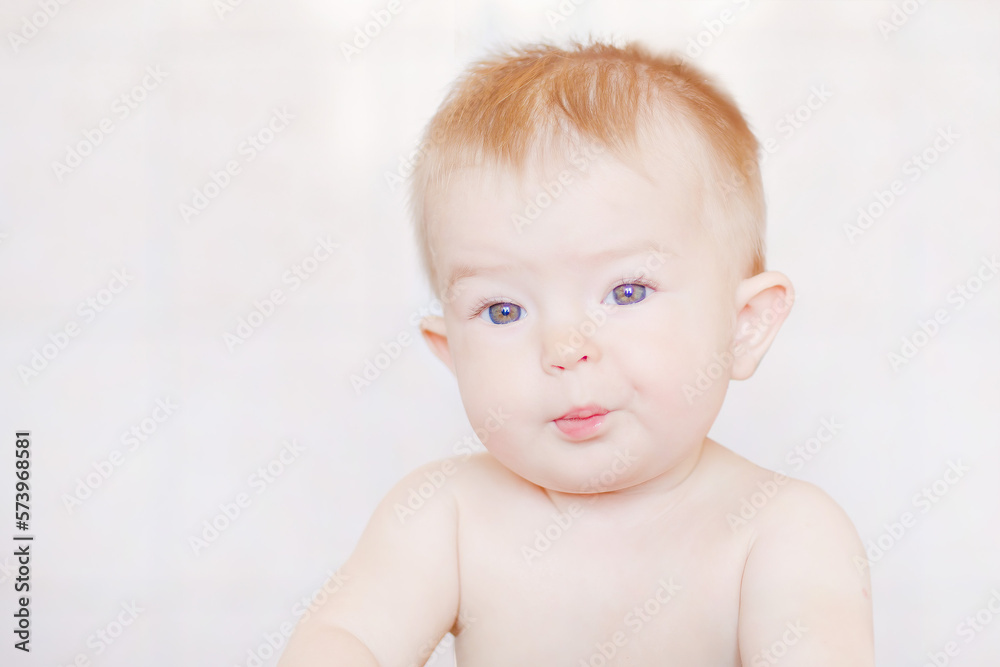Grimaces of a cheery baby. Little cute kid eats with his hands. Happy childhood and delicious food. Funny child gets dirty with food. Close-up of a child's face Grimaces of a cheery baby. Little cute kid eats with his hands. Happy childhood and delicious food. Funny child gets dirty with food. Close-up of a child's face
