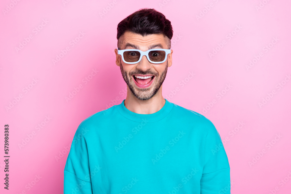 Portrait of young funny excited student man brunet hair surprised laughing watching cinema film wear 3d glasses isolated on pink color background