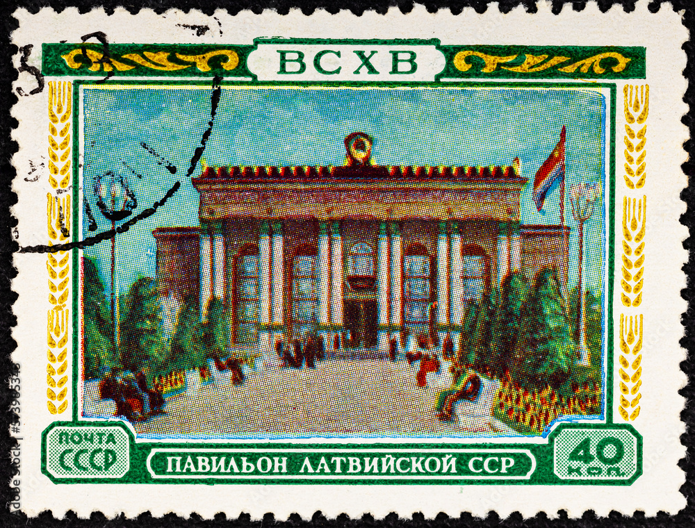 USSR- CIRCA 1954: A stamp printed by the USSR shows pavilion of Latvian SSR of All-Union Exhibition of National Economy, series.
