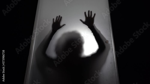 hands and body of raped woman silhouette- domestic family sexual violence at home in apartment - increase in rape and gender-based abuse - shock and fear due to a feminicide