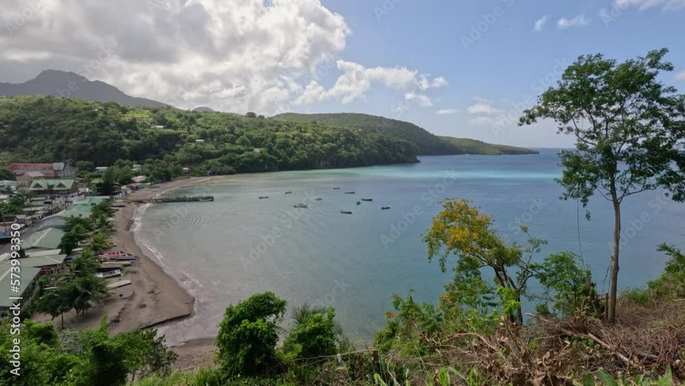 High angle view of beautiful harbor at Anse la Raye, St. Lucia-A quaint fishing village with brightly-colored boats bobbing in the harbor. High angle view of beautiful harbor at Anse la Raye, St. Lucia-A quaint fishing village with brightly-colored boats bobbing in the harbor.
