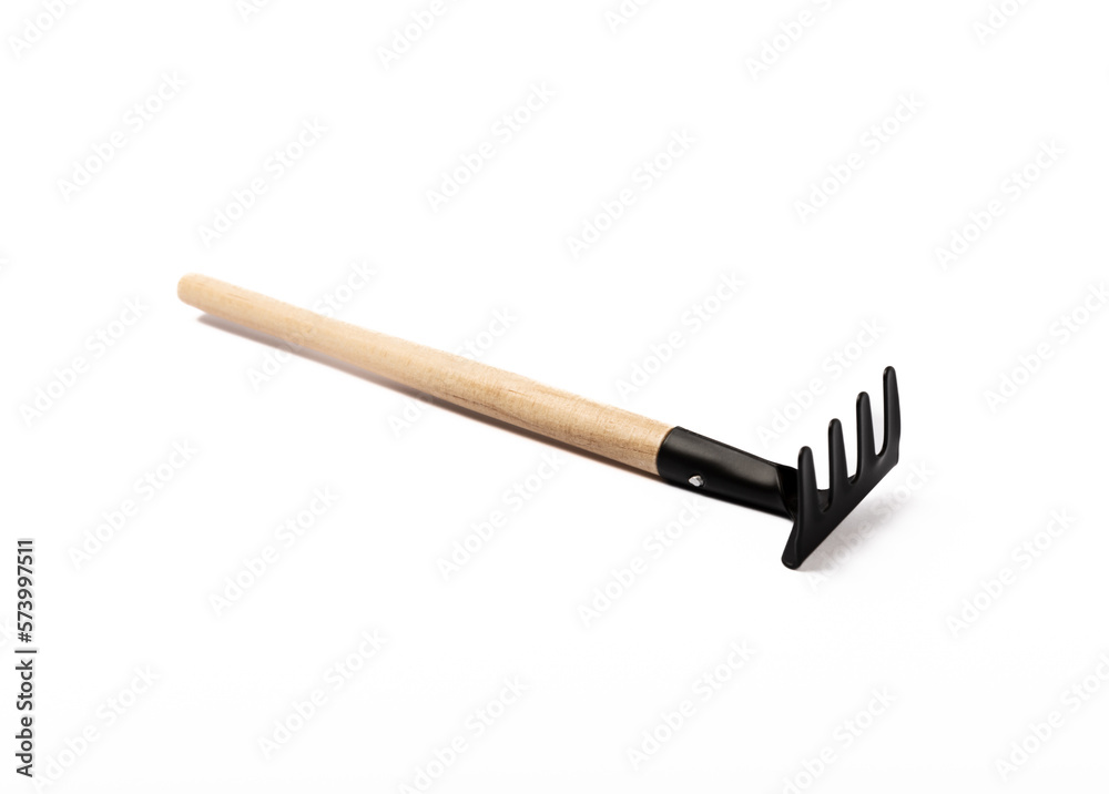 Garden tools isolated on white background. Garden rakes. Garden tools isolated on white background. Garden rakes.