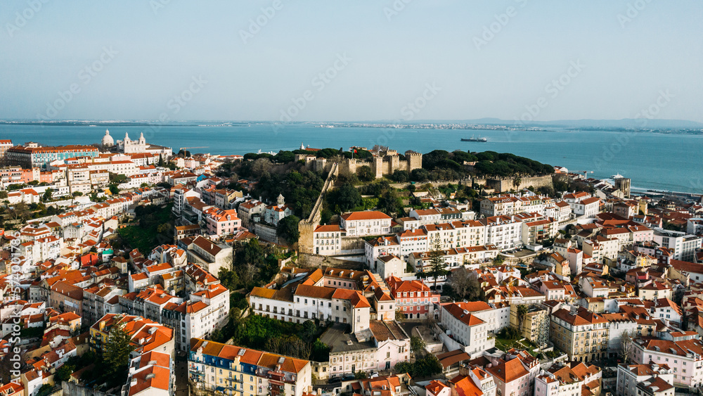 Aerial drone view of St. George Castle in Lisbon, Portugal with surrounding cityscape