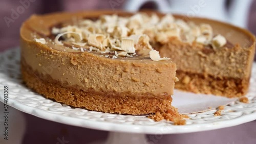 Wallpaper Mural Close up caramel cheesecake on cake stand served with cup of tea. Torontodigital.ca