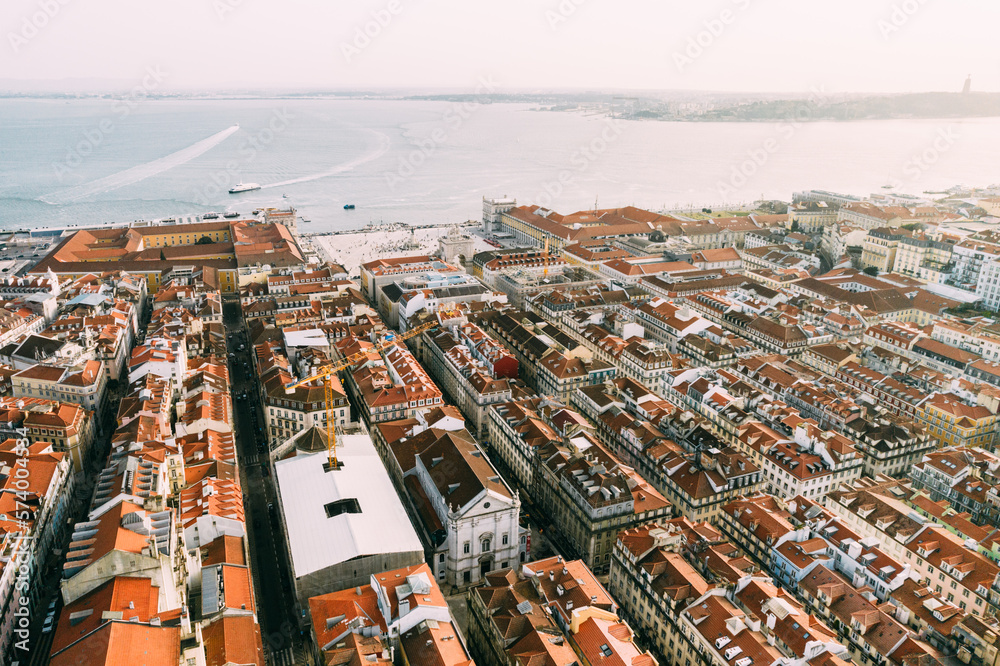 Aerial drone view of Baixa District in Lisbon, Portugal with major landmarks visible
