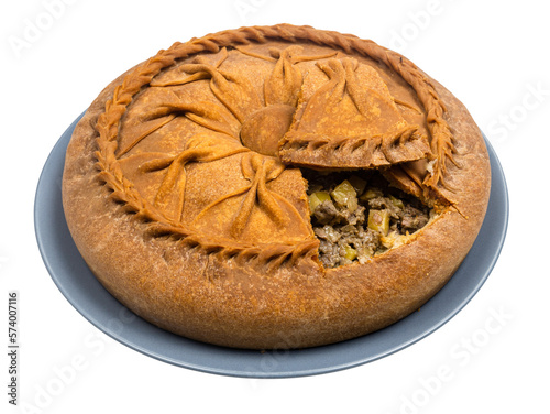 Tatar cuisine - open Zur Belish Tatar Big Pie (close baked pie from unleavened dough with meat and potato fillings) on plate isolated on white background photo