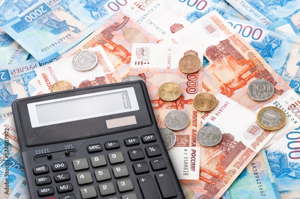 Economy financial concept, calculator on paper currency. Economy financial concept, calculator on paper currency.