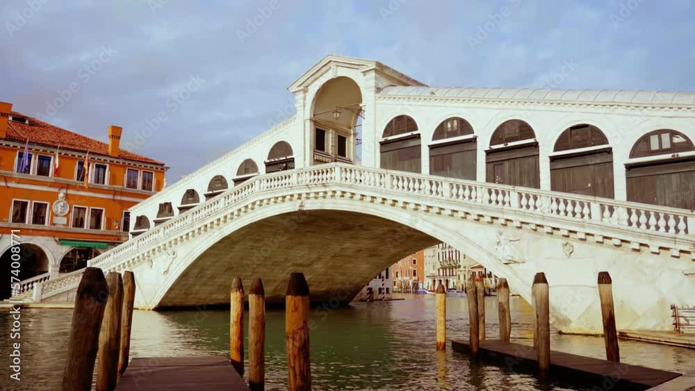 White Rialto bridge with arches and pillars over channel White Rialto bridge with arches and pillars over channel