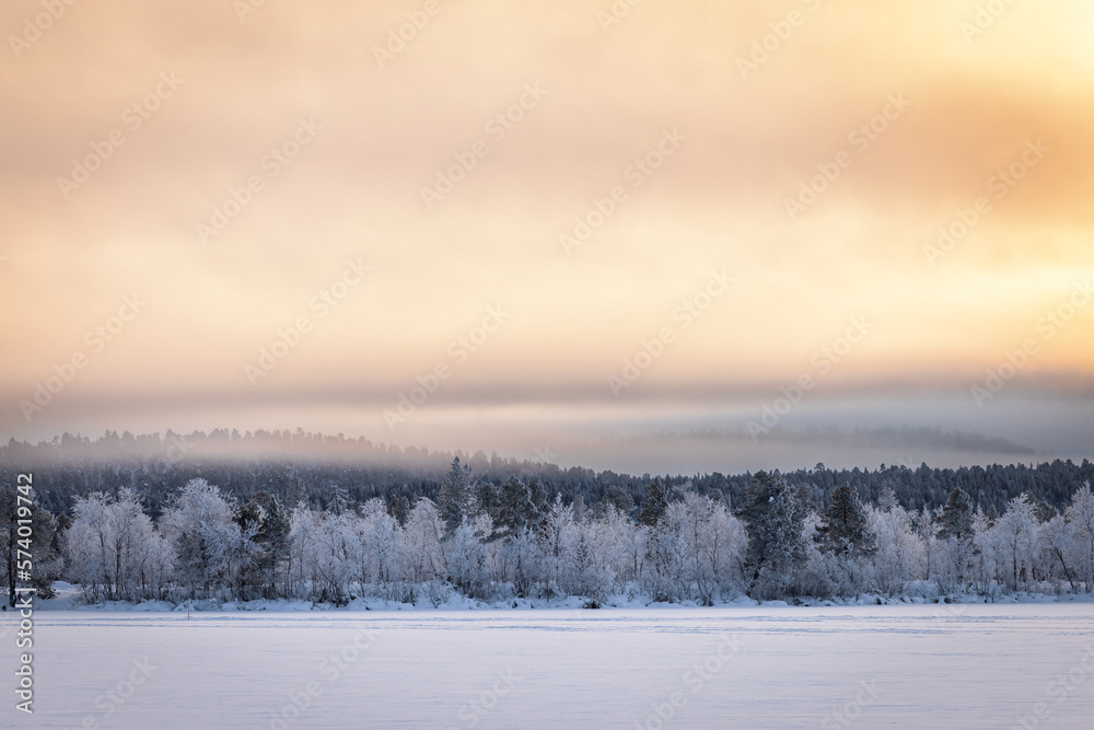 Snowy winter landscape at sunset, Lapland, Finland