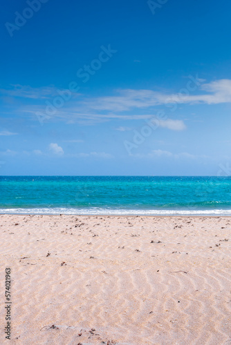 Clear blue sky over beach and ocean