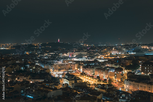 Beautiful panoramic aerial view of Lisbon at night, Christ the King, long exposure, Portugal
