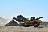 Machine bulldozer excavator on construction site quarry