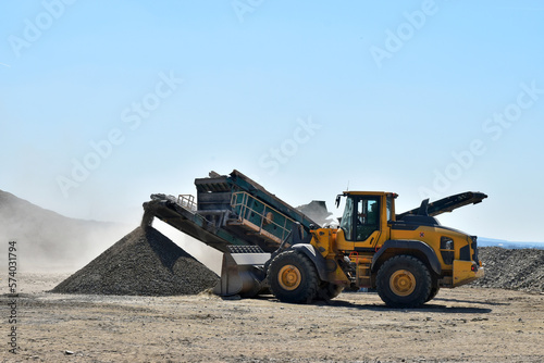 Machine bulldozer excavator on construction site quarry