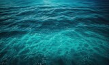  a body of water that is very blue and green with some white dots on the water and the water surface is very blue with some white dots on the water.  generative ai