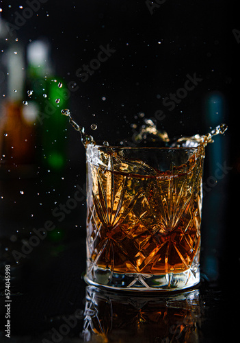 Explosion in a glass of whiskey in a fancy bar