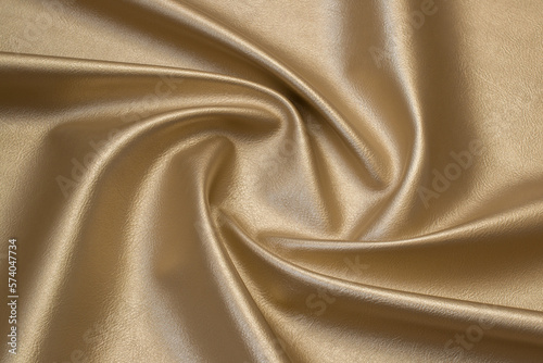 gold metallic artificial leather with waves and folds on PVC base