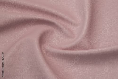 pink artificial leather with waves and folds on PVC base