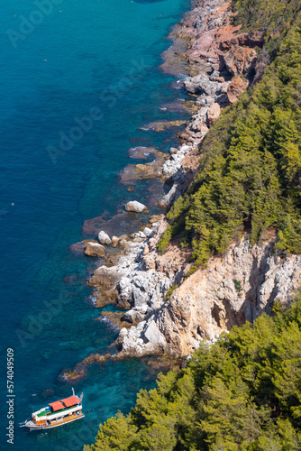Panoramic view from Alanya Castle of the Mediterranean sea, boat and rock