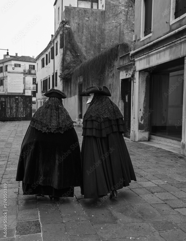 people wearing costumes during the Venice carnival in Italy