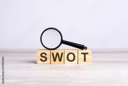 SWOT word made with wooden blocks. can be used for business, marketing and education concept © Maks_Lab