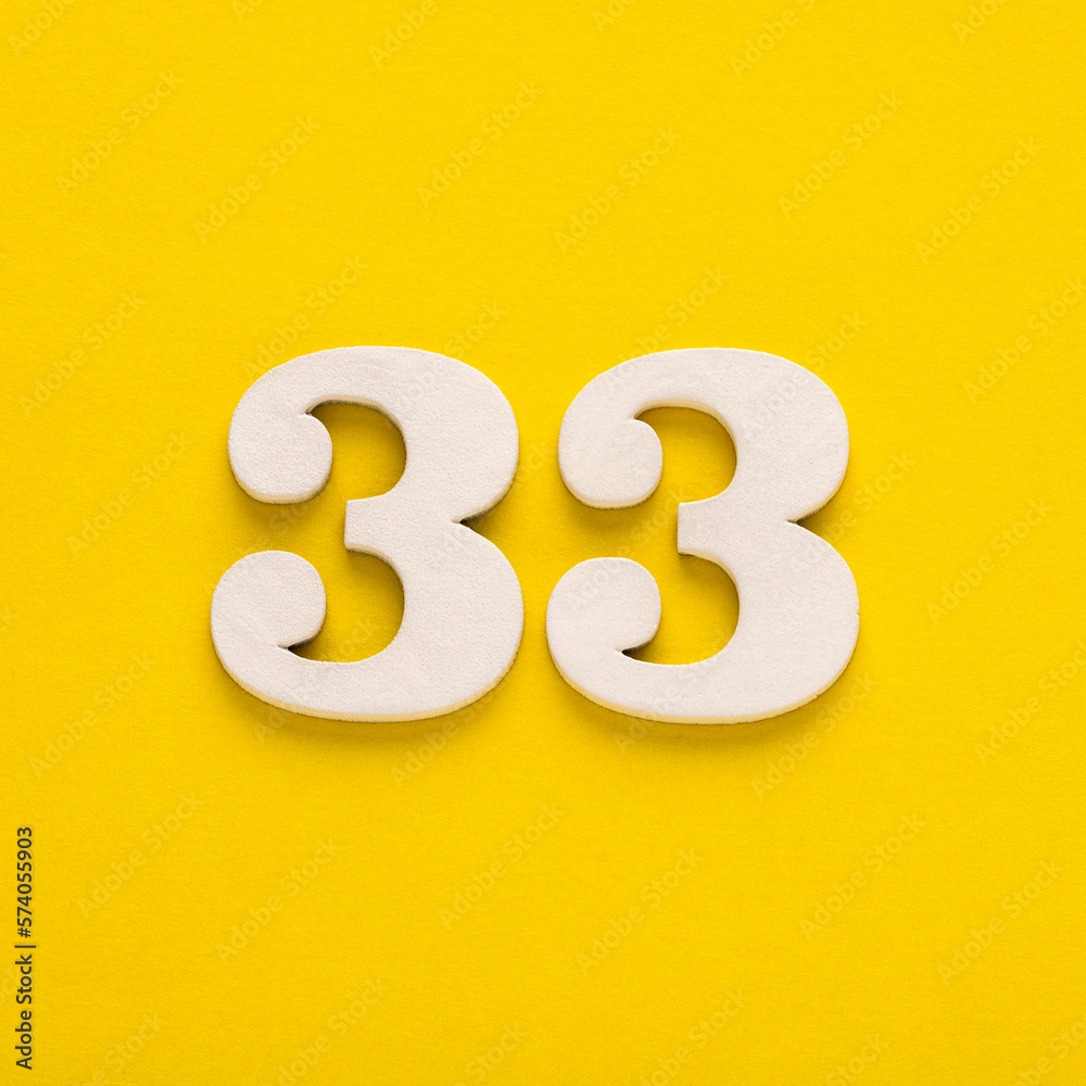 Number 33 on a yellow background - Two-digit number in white Number 33 on a yellow background - Two-digit number in white