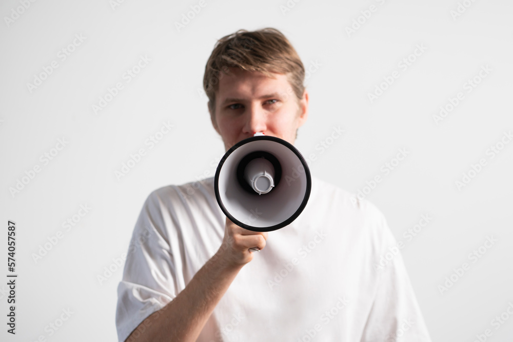 young male screaming in the megaphone, big announcement young male screaming in the megaphone, big announcement