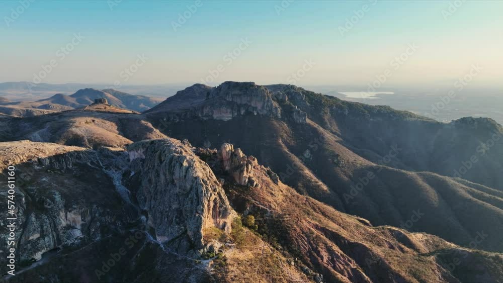 A beautiful aerial view of the endless mountains around the Mexican city of Guanajuato at sunset. A beautiful aerial view of the endless mountains around the Mexican city of Guanajuato at sunset.