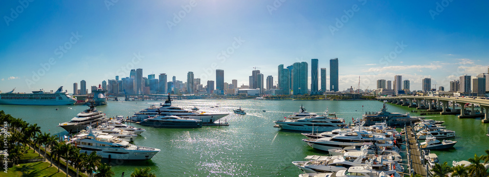 Fototapeta premium Beautiful aerial panorama Miami International Boat Show with view of Downtown Miami in background