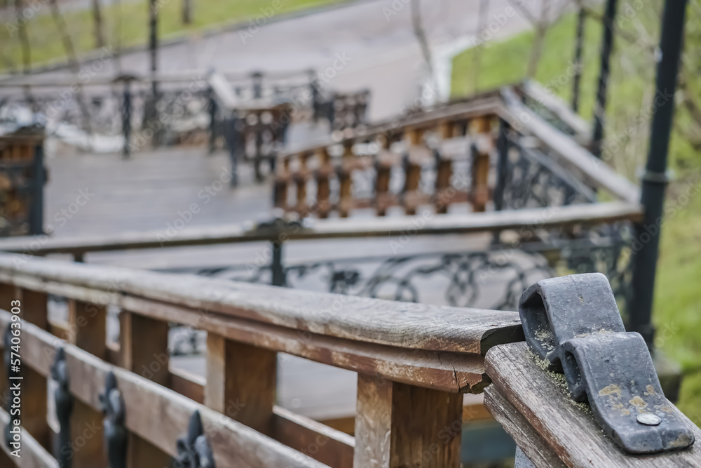 An old staircase made of steel and wood with many decorative elements in the park area of the city of Chernihiv, a staircase with many steps