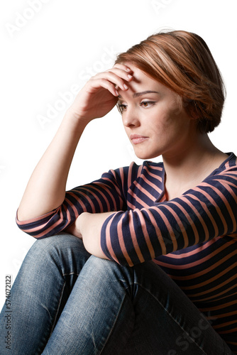 Young woman crying on brick background