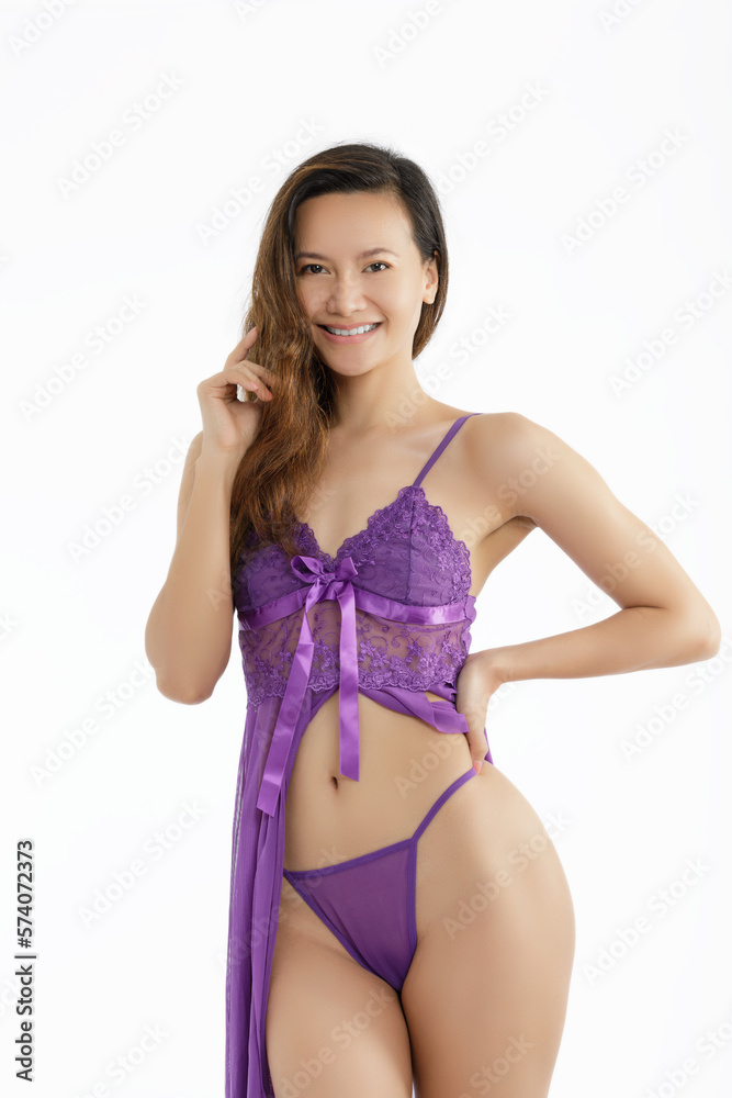 Fototapeta premium Philippine woman posing in sexy Purple Silk Lngerie white background