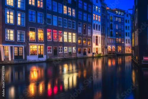 Amsterdam night, red light district night with colorful windows near the basilica of saint nicholas