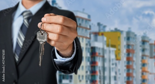 Real estate worker hold keys from apartment
