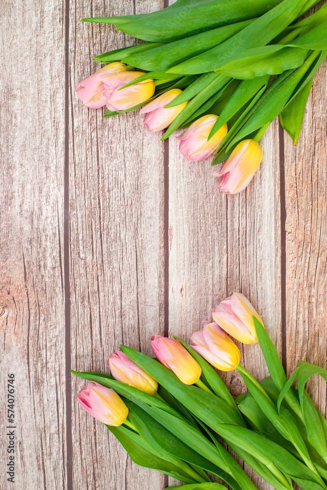 Womens day background. Pink tulips on a wooden background with a place for text. International Women's Day, March 8, Mother's Day, Valentine's Day. Copy space. Womens day background. Pink tulips on a wooden background with a place for text. International Women's Day, March 8, Mother's Day, Valentine's Day. Copy space.