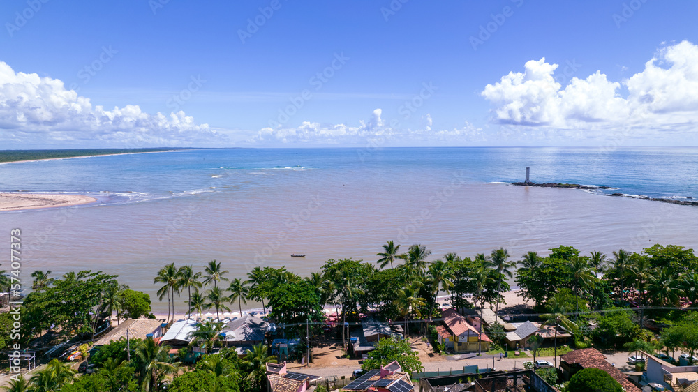 Aerial view of Itacare beach, Bahia, Brazil. Village with fishing boats and old lighthouse