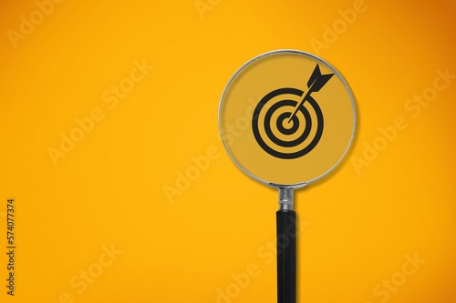 Magnifier glass focuses on image of target icon.