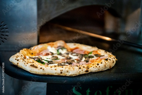 Pizza napoletana in preparation by pizzaiolo