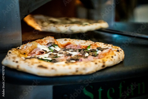 Pizza napoletana in preparation by pizzaiolo