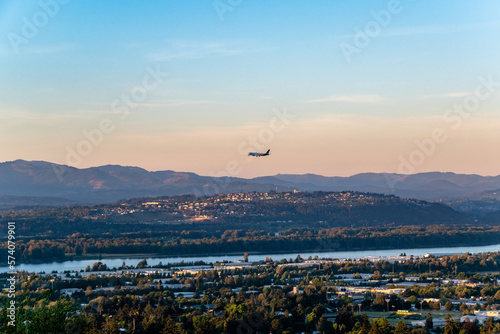 Plane Preparing to land in Portland PDX Airport with Washington Landscape