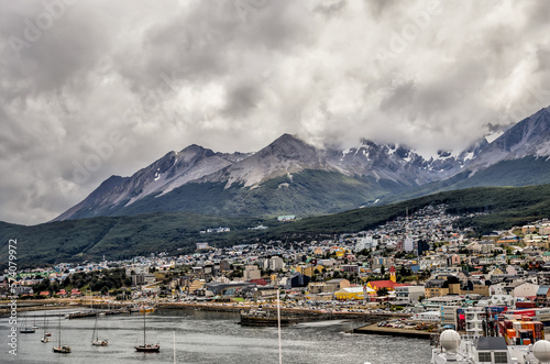 Ushuaia, Argentina - December 28, 2022: The city skylines on the mountain slopes of Ushuaia, Argentina with the port visible in the background 