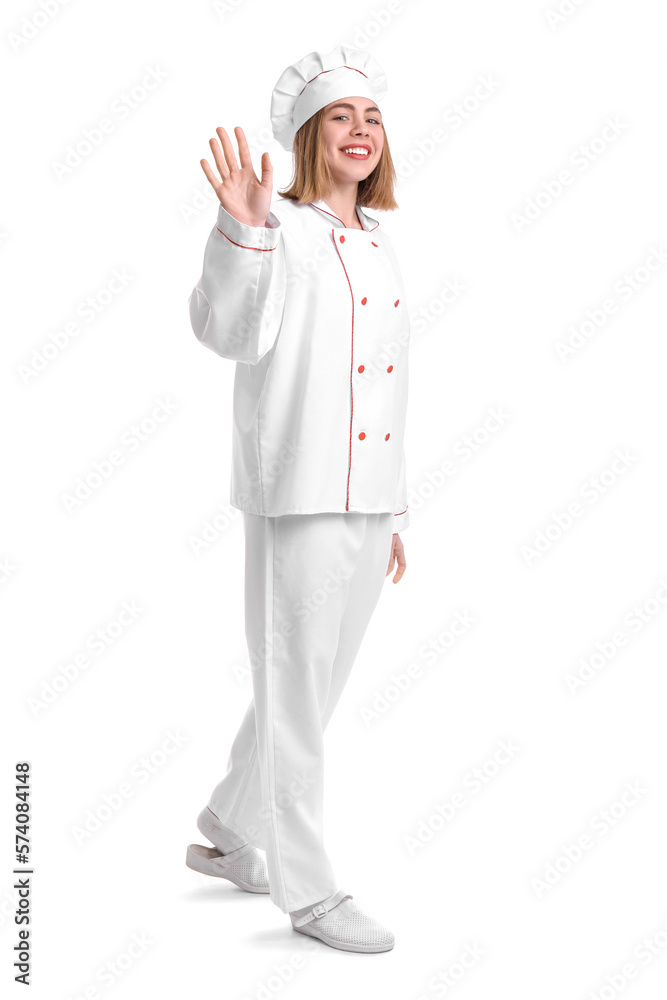 Female baker in uniform waving hand on white background Female baker in uniform waving hand on white background