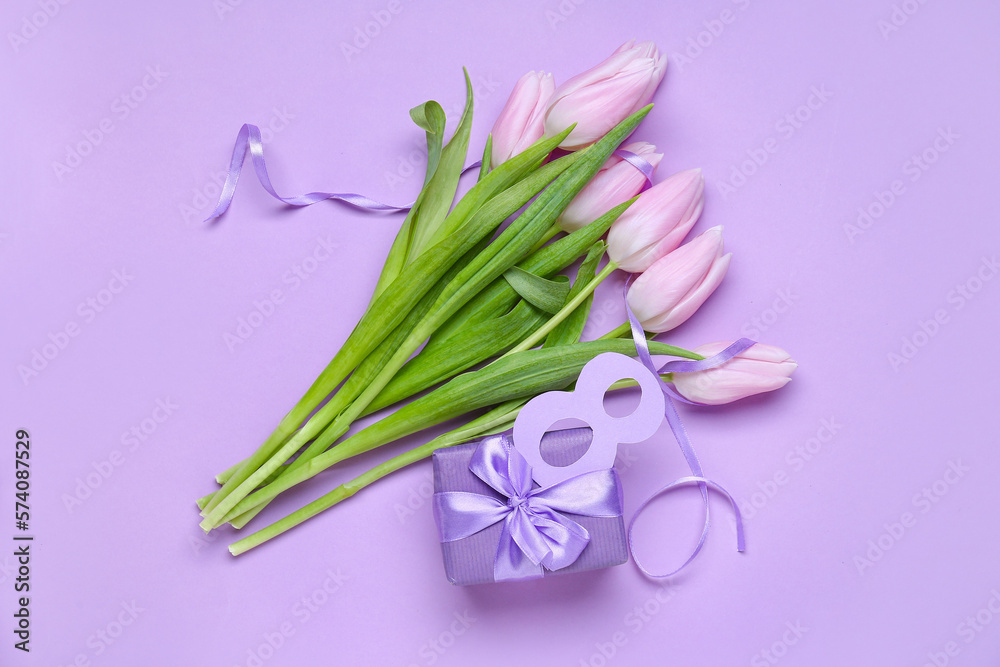 Naklejka premium Bouquet of beautiful tulip flowers and gift for Women's Day celebration on lilac background. Women's Day celebration
