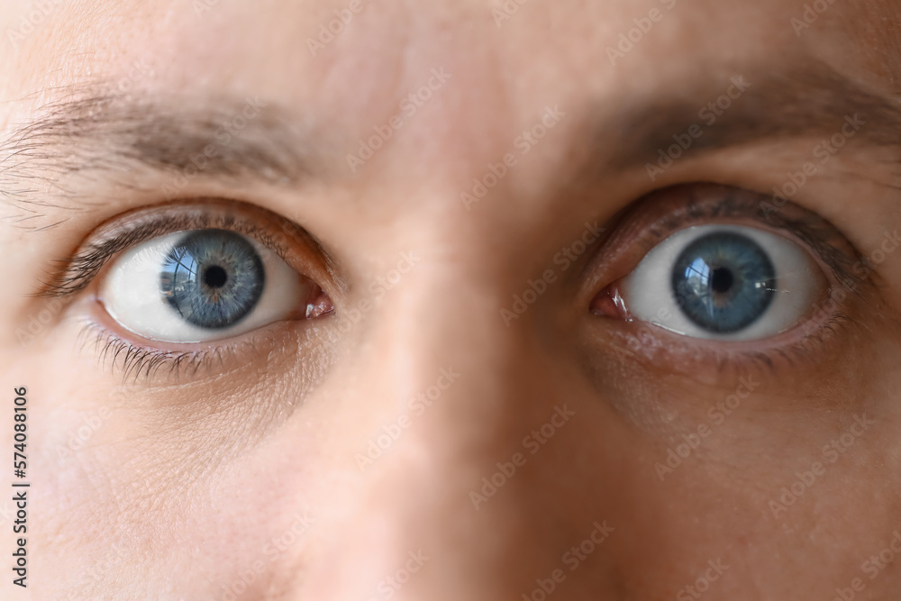 Fototapeta premium Man with blue eyes, closeup