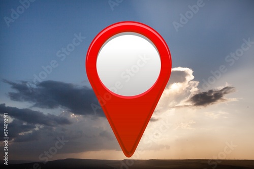 Big field with blue sky and big location red pin