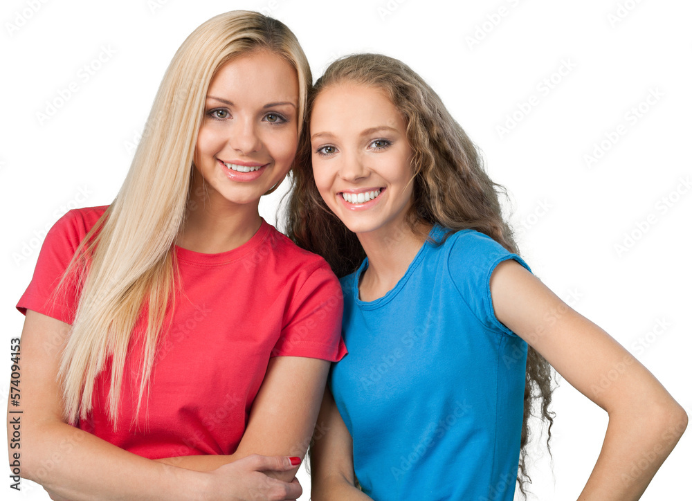 Portrait of beautiful young girls standing and posing while looking at camera, isolated on white Portrait of beautiful young girls standing and posing while looking at camera, isolated on white