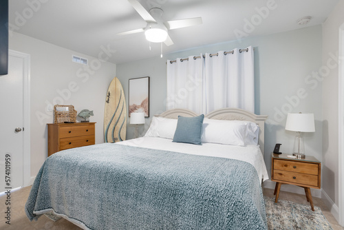 Pale blue bedroom decor with surfboard in vacation rental, Cape Canaveral, Florida