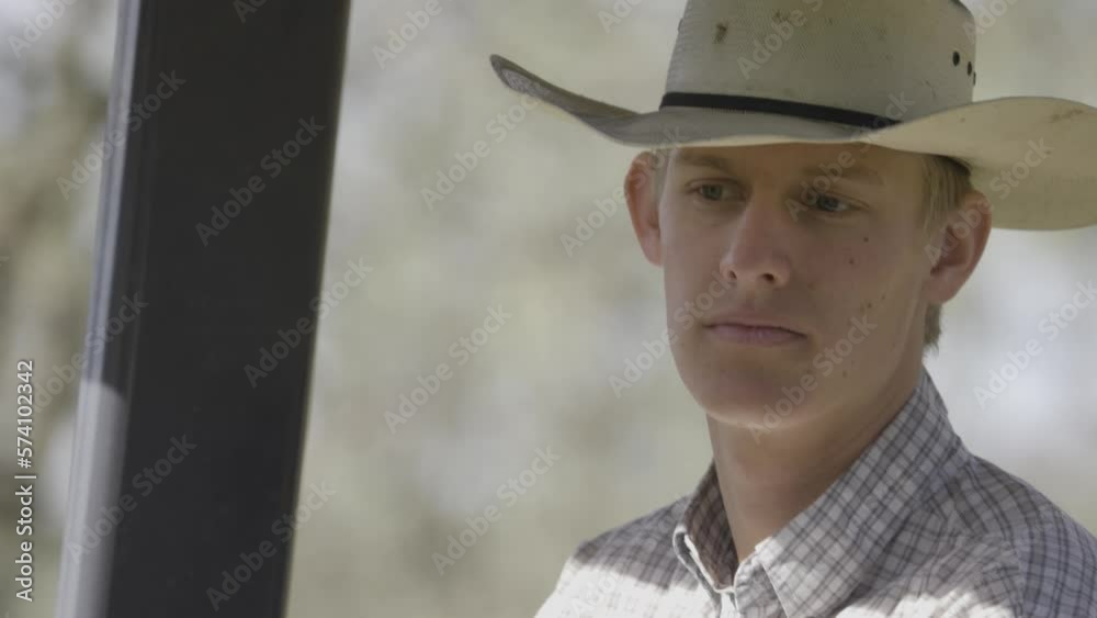 Close up of Cowboy on Tractor Close up of Cowboy on Tractor