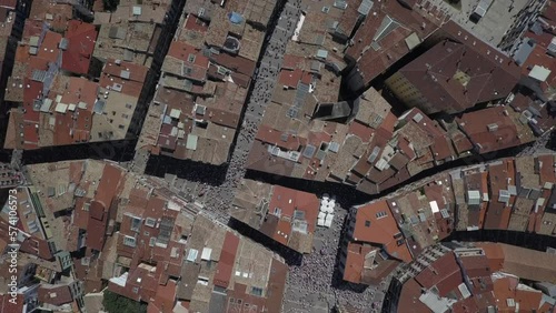 Bird's eye view aerial: tourist visitors gathered on Pamplona streets photo